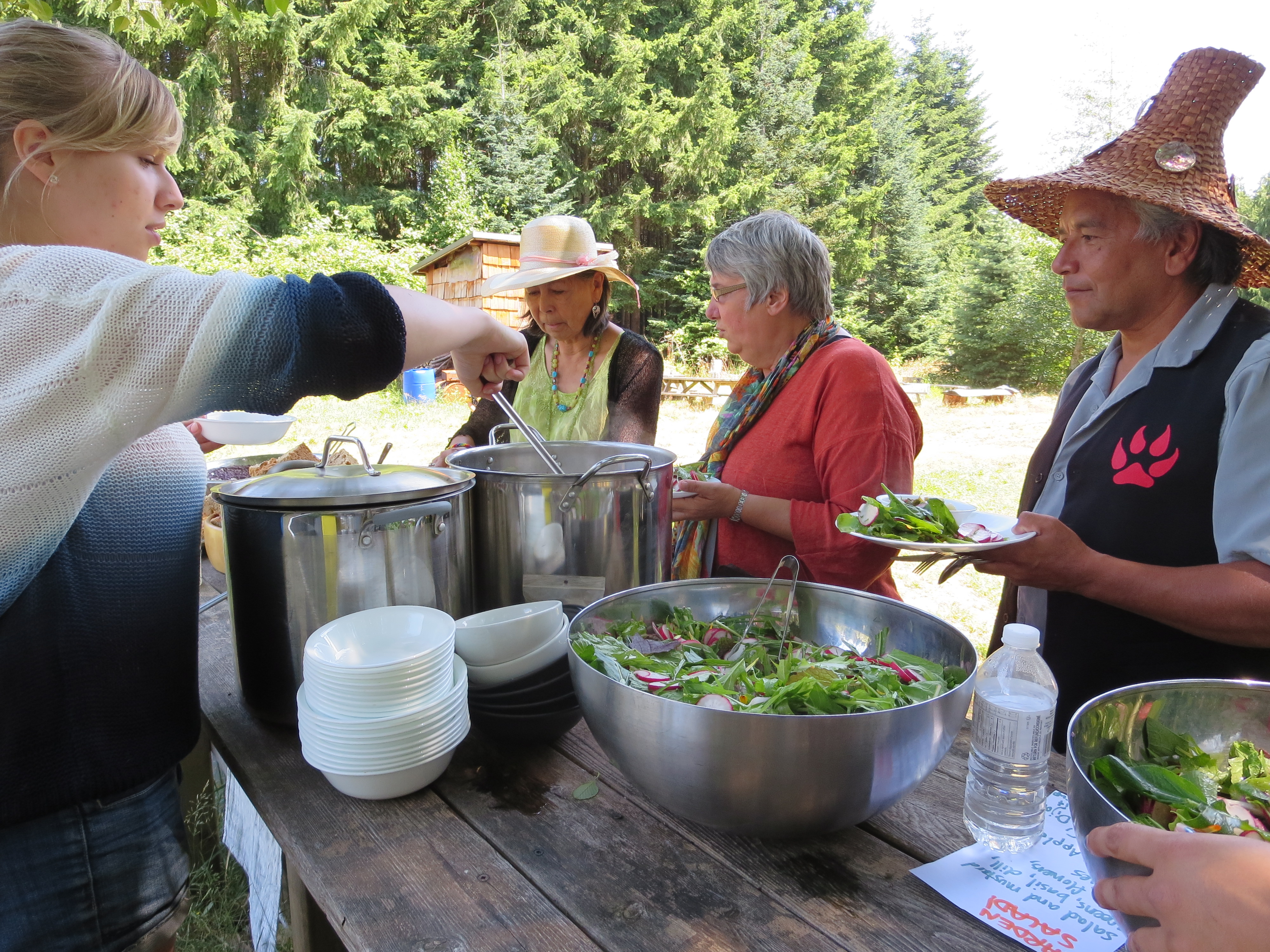 UBC students have the unique opportunity to undertake directed studies internships with the Indigenous Initiatives. Pictured here: the 2014 Feast Bowl Intern serves lunch to Elders.