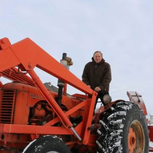 Saskatchewan farmer sitting on a tractor