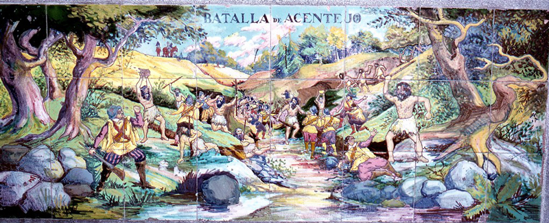 A painted wall mural in Santa Cruz, Tenerife, depicting the Battle of Acentejo, showing the Guanches winning against armed and fully dressed Spaniards in spite of their technological inferiority.